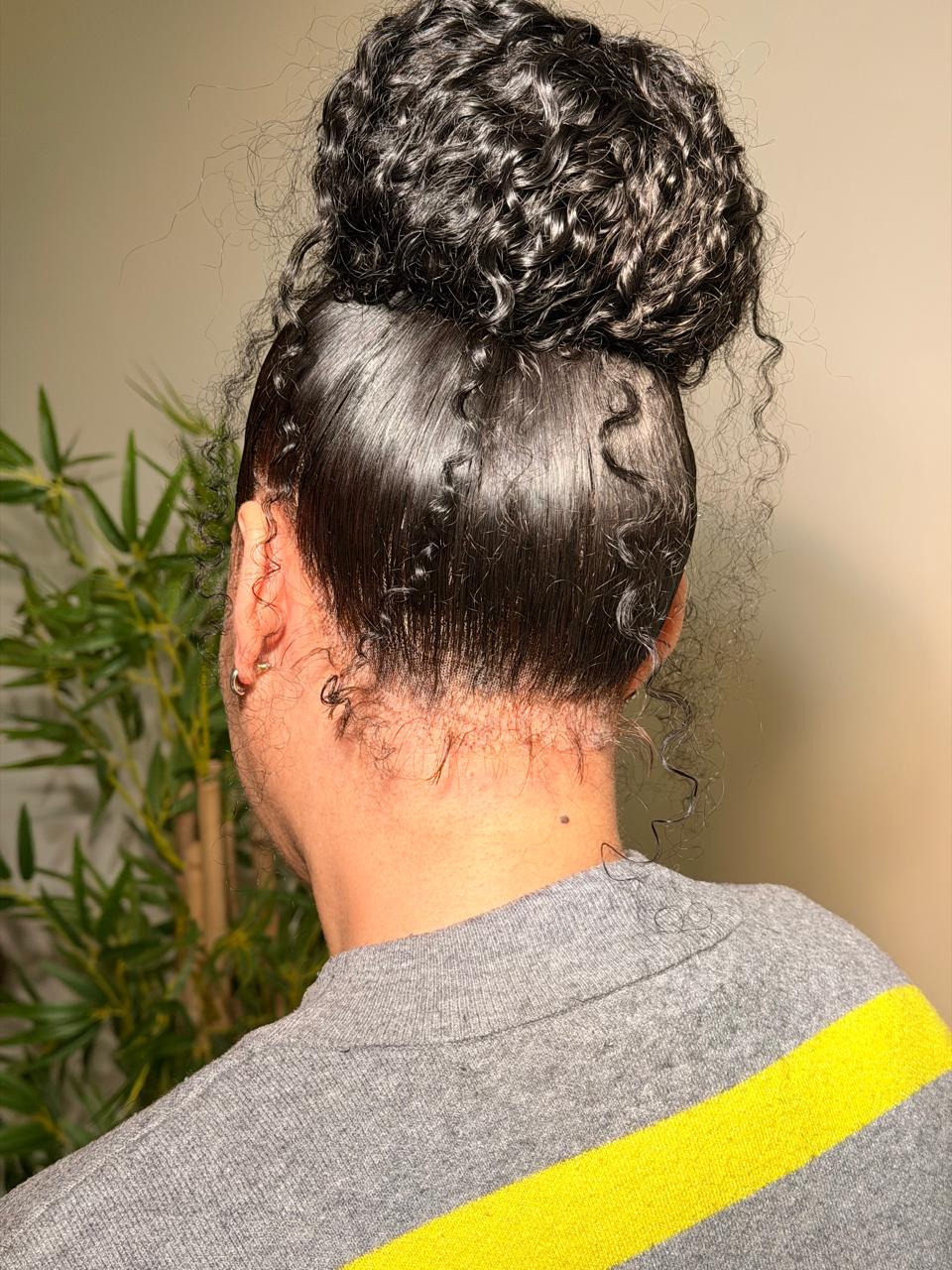 Rear view of a curly two-frontal ponytail with a smooth finish