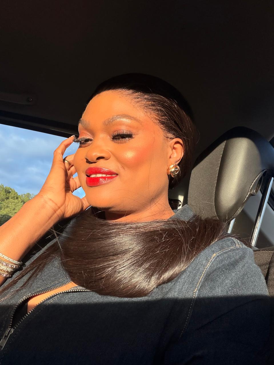Danielle, the woman behind Luxehair & Wigs, wearing a sleek ponytail